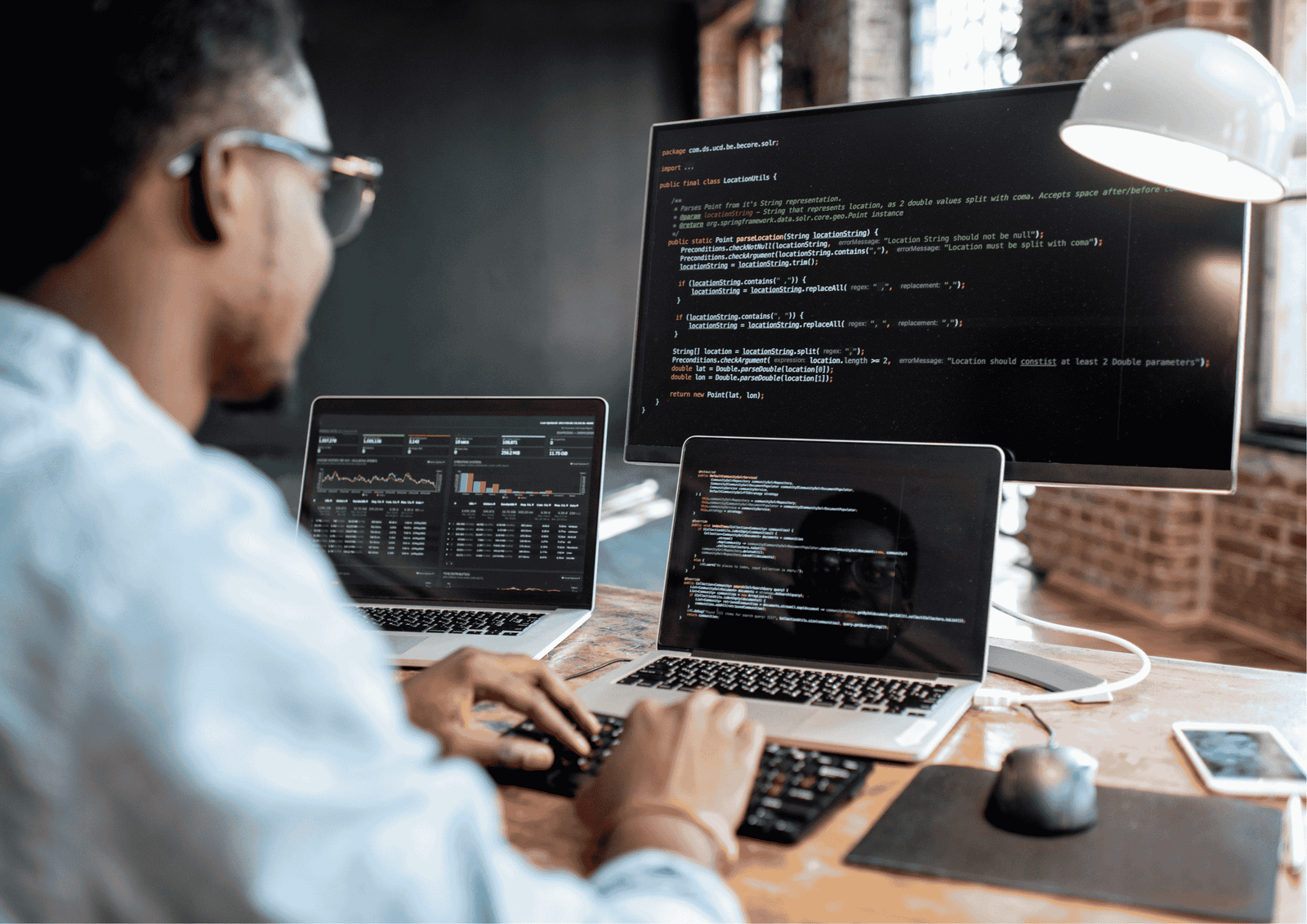 Codevant solutions workspace showing different monitors with code and Benson writing the code
